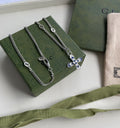 GUCCI WOMEN'S NECKLACE WITH CROSS MOTIF PENDANT