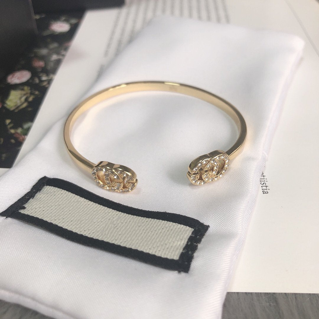 GUCCI GOLD RUNNING DIAMOND LOGO BANGLE BRACELETS