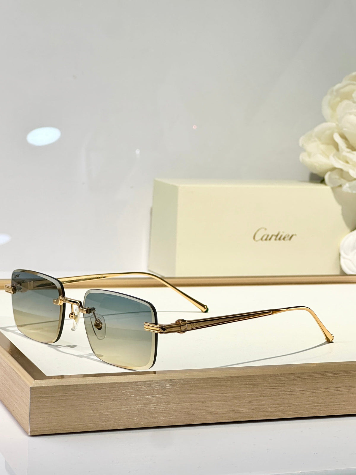 CARTIER RIMLESS SQUARE FRAME SUNGLASSES CT0610S IN METAL