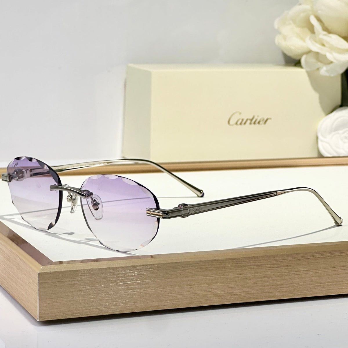 CARTIER RIMLESS ROUND FRAME SUNGLASSES CT0611S IN METAL