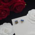 LOEWE ANAGRAM BLUE GOLD STUD EARRINGS